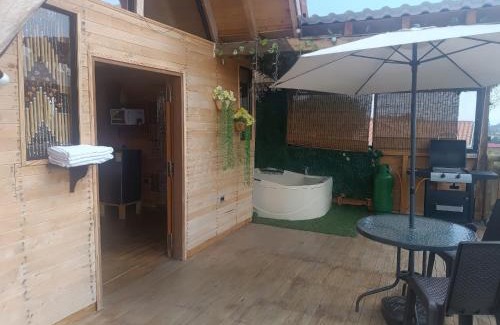 Guarne House | Relax in a Cozy Cabaña with Jacuzzi and BBQ Zone