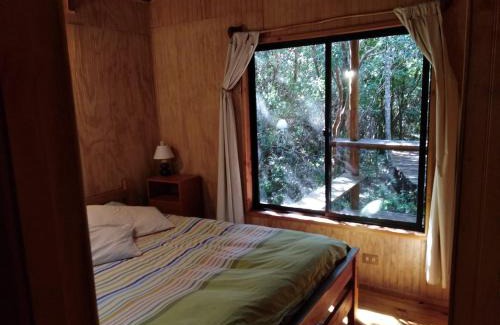 Puelo House | Cozy Cabaña en Río Puelo with Hot Tub & Fireplace