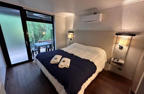 San Pedro de la Paz House | Cozy Cabaña Habitainer BordeRio 3 with Fireplace & Hot Tub