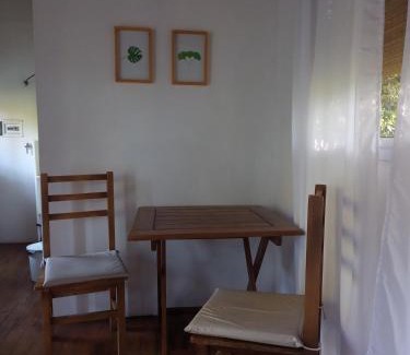 Villa Elisa Apartment | Cozy Cabin with Pool and Lush Garden Retreat