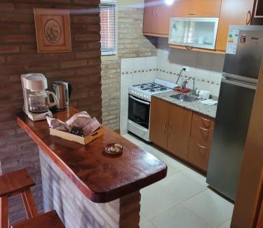 Embalse Apartment | Beachfront Cabañas Brick House with Pool & Spa Amenities