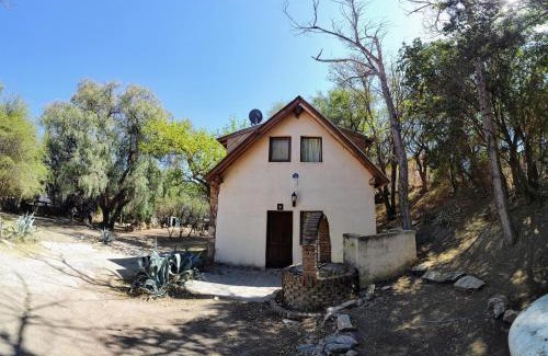 Capilla del Monte Ski Chalet | Discover Cabañas Budapest: Oceanfront Retreat with Pool