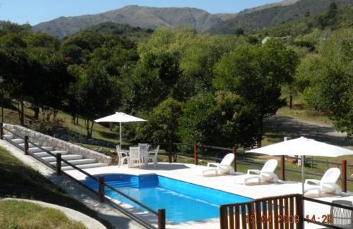 La Falda Cabin | Cozy Cabañas Los Gauchitos: Pet-Friendly with Pool Access