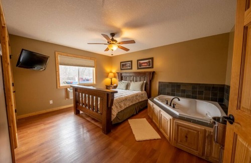 Isle Resort | Cabin 8 Our Romantic Suite offers a jetted tub and views of Mille Lacs lake