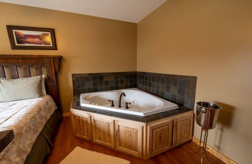 Isle Resort | Cabin 8 Our Romantic Suite offers a jetted tub and views of Mille Lacs lake