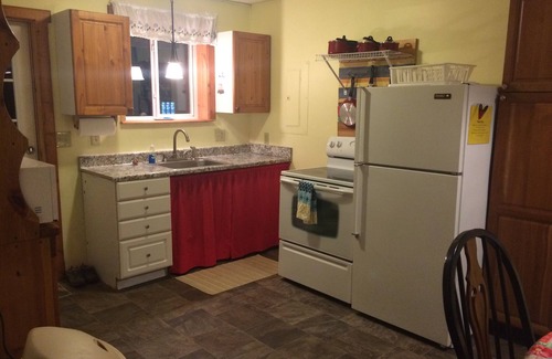 Branch Cabin | Pet-Friendly Pere Marquette River Front Cabin with Pool