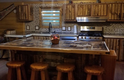 Boyne Falls Cabin | Riverside Cabin: Family-Friendly Getaway with Kitchen