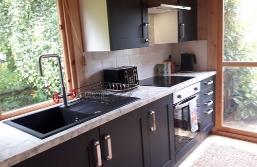 Hatherton Cabin | Romantic Tropical Garden Cabin with Family-Friendly Amenities