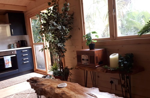 Hatherton Cabin | Romantic Tropical Garden Cabin with Family-Friendly Amenities