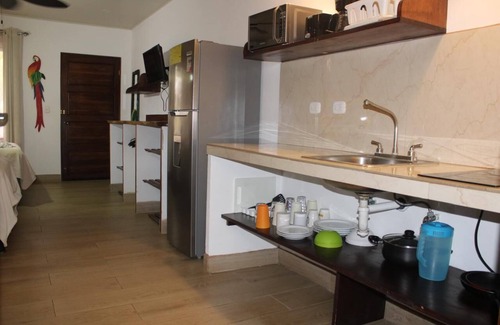 Puerto Carrillo Hotel | Guest Rated: Cabinas el Colibri with Pool & Spa Amenities