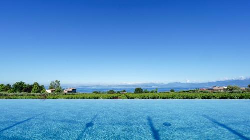 Cisano Apartment | Relax at CALA Appartamenti: Oceanfront Family Retreat