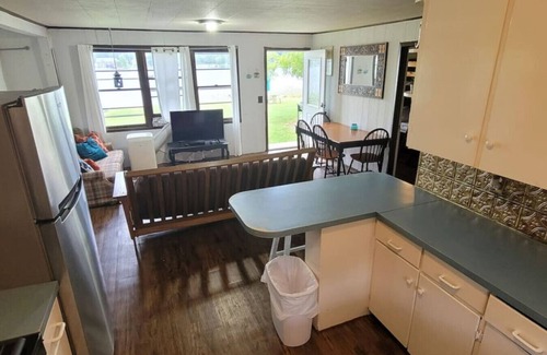Alto House | Campau Lake Sunshine Cottage with Tiki game house 5 King Beds