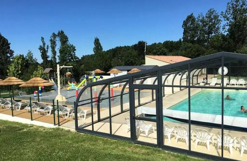 Aubigny-les-Clouzeaux House | Relaxing Retreat at Camping Campilo: Lakefront 4-Room Cottage
