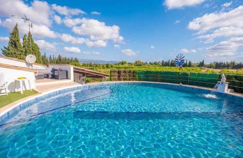 Llubi Villa | Experience Can Pintat: Oceanfront Poolside Retreat