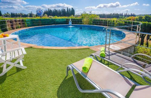 Llubi Villa | Experience Can Pintat: Oceanfront Poolside Retreat