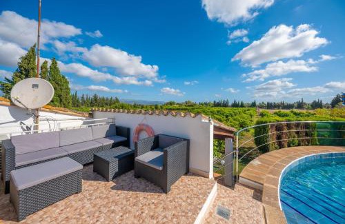 Llubi Villa | Experience Can Pintat: Oceanfront Poolside Retreat
