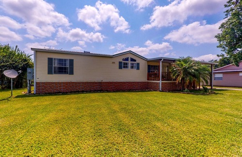 Astor House | Canal-Front Home with Private Covered Boat Dock & Waterfront Screened Porch