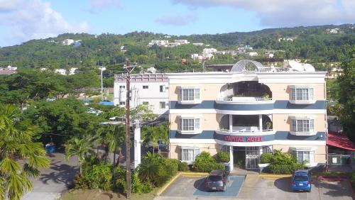 Garapan Apartment | Capital Hotel: Ocean View with Pool & Family-Friendly Amenities
