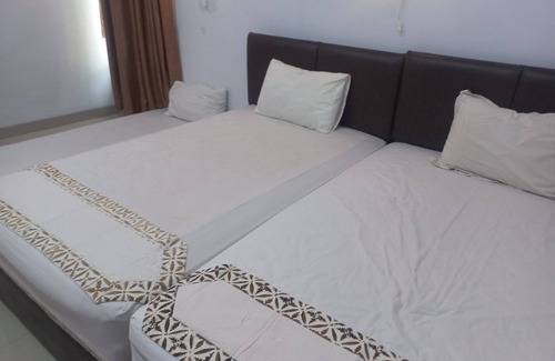 Purwokerto Hotel | Budget-Friendly Natura Guest House with Breakfast & Family Care