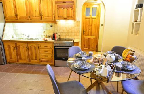 Archaia Feneos Ski Chalet | Experience Capris Rustic House with Scenic Mountain Views