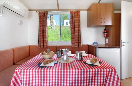 Pratolungo RV Rental | Cozy Caravan 'Mobile Home Comfort 1' with Lake View & Pool