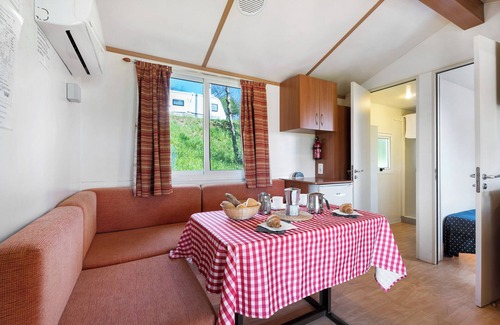 Pratolungo RV Rental | Cozy Caravan 'Mobile Home Comfort 1' with Lake View & Pool