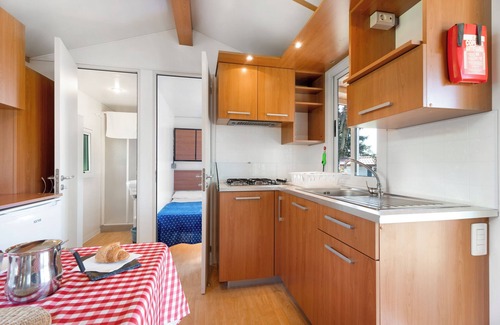 Pratolungo RV Rental | Cozy Caravan 'Mobile Home Comfort 1' with Lake View & Pool