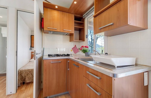 Pratolungo RV Rental | Scenic Caravan Mobile Home with Lake View and Shared Pool