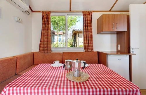 Pratolungo RV Rental | Scenic Caravan Mobile Home with Lake View and Shared Pool