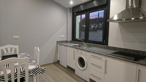 Arzua Apartment | Oceanfront Carballos Altos: Top-Rated Family Getaway