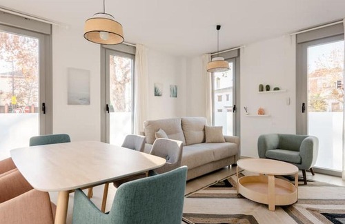 Genil Apartment | Discover Comfort at Carmela Suites - Family Friendly Stay