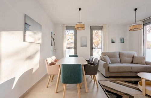 Genil Apartment | Discover Comfort at Carmela Suites - Family Friendly Stay