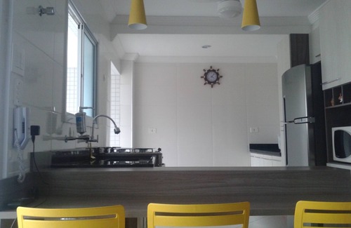 Praia Grande Condo | Sea View Haven: Enjoy a Balcony with Barbecue & Spa