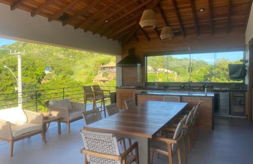 Brava House | Elegant Casa Just Steps from Praia Brava with Ocean Views
