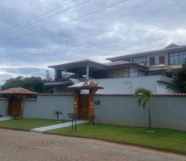 Brava House | Elegant Casa Just Steps from Praia Brava with Ocean Views