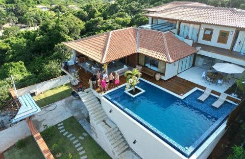 Brava House | Elegant Casa Just Steps from Praia Brava with Ocean Views