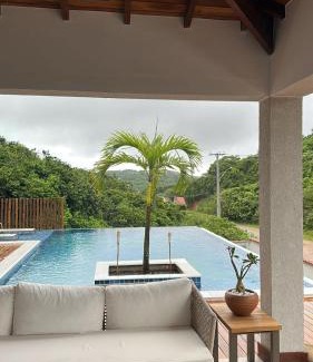 Brava House | Elegant Casa Just Steps from Praia Brava with Ocean Views