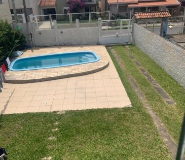 Tramandai House | Inviting Casa with 4 Bedrooms and Pool for Your Getaway
