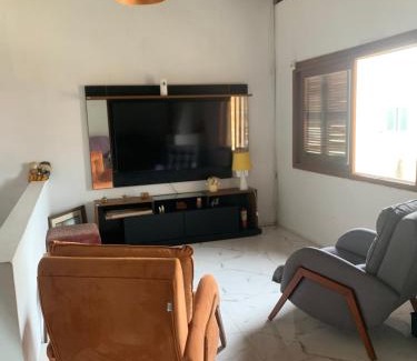 Tramandai House | Inviting Casa with 4 Bedrooms and Pool for Your Getaway