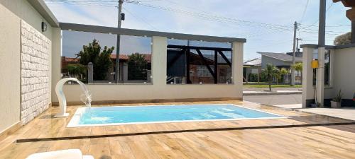 Capao da Canoa House | Pet-Friendly Oasis with Pool Near the Ocean in Capão Da Canoa