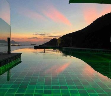 Portogalo House | Experience Spectacular Views and Poolside Relaxation in Angra