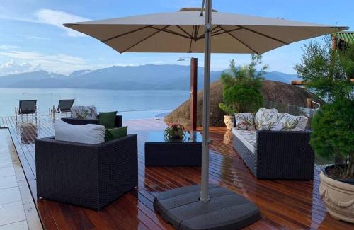 Portogalo House | Experience Spectacular Views and Poolside Relaxation in Angra