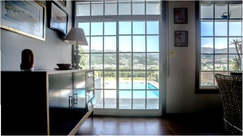 Tomino House | Riverside Retreat with Pool and Ocean Views