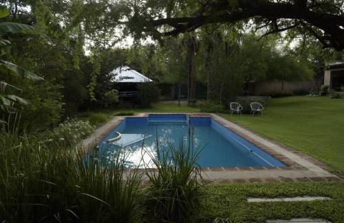 Cordoba Apartment | Exceptional Casa de Flores: Poolside Serenity Awaits