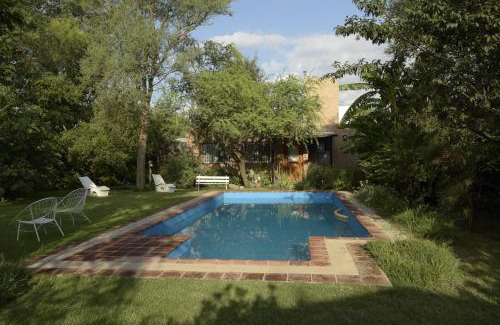 Cordoba Apartment | Exceptional Casa de Flores: Poolside Serenity Awaits