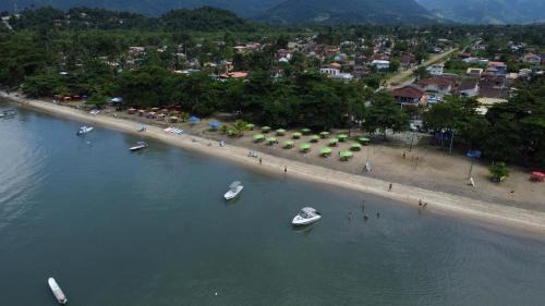 Jabaquara House | Idyllic Casa de Praia: Oceanfront Retreat with Spa & More