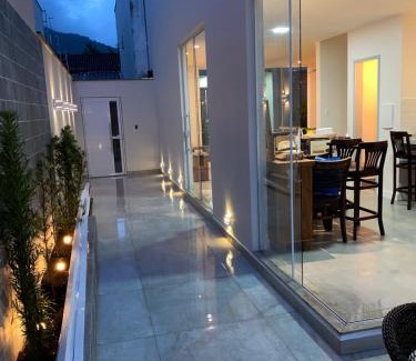 Jabaquara House | Idyllic Casa de Praia: Oceanfront Retreat with Spa & More