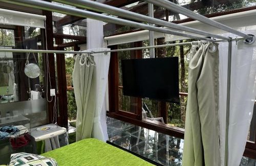 Bueno Brandao Apartment | Experience Casa de Vidro - Vila Mágica with Oceanfront Views