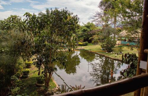 Chinauta Hotel | Romantic CASA DEL ÁRBOL with Pool and Ocean Views in Chinauta