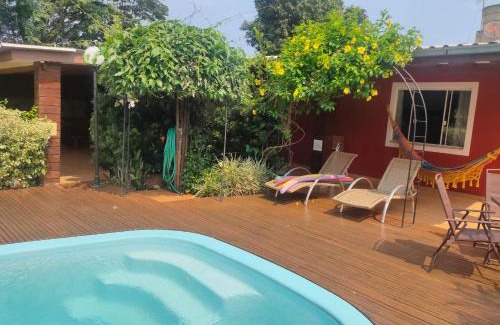 Foz do Iguacu Ski Chalet | Palm-Surrounded Casa do Mato near Iguassu Falls with Pool